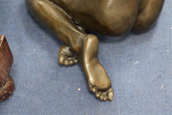 After Enzo Plazzota. A bronze model of a seated nude woman, height 25in.